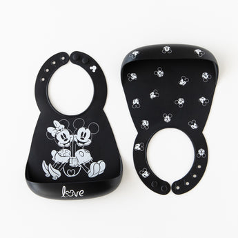 Bumkins Silicone Bib 2 Pack: Disney Mickey and Minnie Mouse is neatly arranged on a white background.