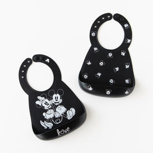 Bumkins Silicone Bib 2 Pack: Disney Mickey and Minnie Mouse is arranged on a white background.