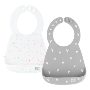 Bumkins Silicone Bib 2 Pack: Vanilla Sprinkle and Hearts includes 2 silicone bibs in gray and white with pocket and adjustable closure.