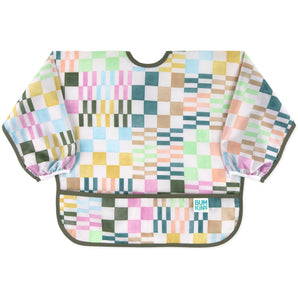 Bumkins Sleeved Bib: Motley Check features a colorful variegated checkered print on waterproof fabric, front pocket, and elastic cuffs.
