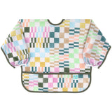 Bumkins Sleeved Bib: Motley Check features a colorful variegated checkered print on waterproof fabric, front pocket, and elastic cuffs.