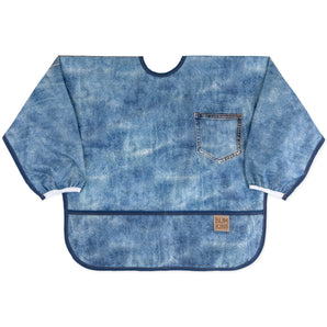 Bumkins Sleeved Bib: Vintage Denim features blue denim printed waterproof fabric with a pocket design, front pocket, & elastic cuffs.