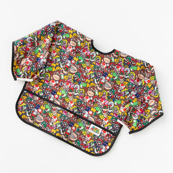 Bumkins Sleeved Bib: Super Mario™ Mashup rests at an angle on a white background.