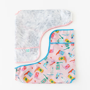 Bumkins Sleeved Bib 2 Pack: Disco Boots lays neatly folded on a white background.