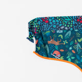Close-up of Bumkins Sleeved Bib 2 Pack: Jungle and Animal Print stacked on a white background, with focus on the sleeves.