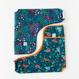 Bumkins Sleeved Bib 2 Pack: Jungle and Animal Print lays neatly folded on a white background.