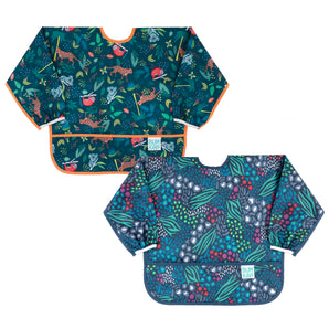 Bumkins Sleeved Bib 2 Pack: Jungle and Animal Print—2 dark blue waterproof bibs with animal designs, front pockets, & adjustable closures.