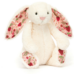 The Jellycat Blossom Bunny Berry Little is a plush white bunny with Bashful fur and pink floral-patterned ears, sitting upright.