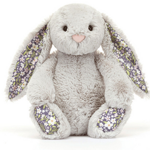 Meet Jellycats Blossom Bunny Silver: a gray plush with floral accents, sitting upright—the ideal nighttime companion.