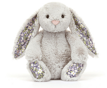 Meet Jellycats Blossom Bunny Silver: a gray plush with floral accents, sitting upright—the ideal nighttime companion.