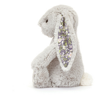 Side view of Blossom Bunny Silver, a plush gray bunny with floral ears and white tail by Jellycat—a perfect nighttime companion.