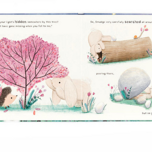 In Jellycats Smudge Rabbit and the Falling Star book, Smudge Rabbit searches by a tree for a tale, but finds nothing near the log and rock.