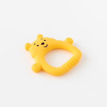 Bumkins Silicone Flat Teether: Winnie the Pooh lays flat on a white background.