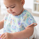 Close-up of a child wearing a Bumkins Junior Bib: Disney Aloha Stitch.