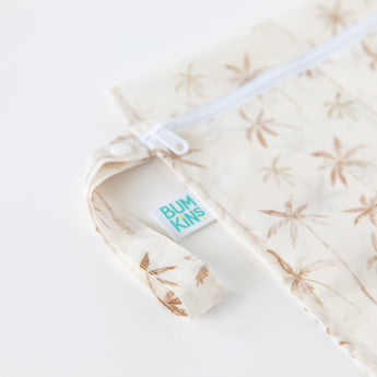 Bumkins Wet Bag + Wet/Dry Bag Set: Palm Daze—stylish, waterproof reusable bags for organized packing.