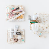 Bags from Bumkins The Chaos Coordinator Deluxe 5-Piece Set: Palm Daze holds makeup, toiletries, and travel essentials on a white background.