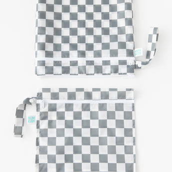 Bumkins Wet Bag + Wet/Dry Bag Set: Charcoal Check is vertically arranged on a white background with only the top half of the bags visible.