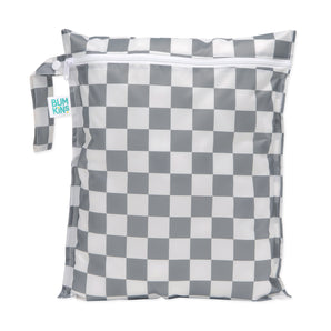 Bumkins Wet Bag: Charcoal Check features a gray and white checkered pattern on waterproof fabric, a zipper closure, and a side handle.