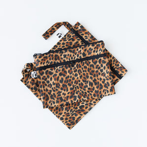 Roamio by Bumkins Wet Bag + Wet/Dry Clutch Set: Leopard lays stacked on a white background.