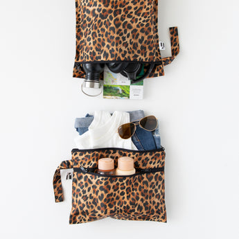 Roamio by Bumkins Wet Bag + Wet/Dry Clutch Set: Leopard holds travel essentials on a white background.