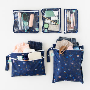 Bumkins The Chaos Coordinator Deluxe 5-Piece Set: Evil Eye holds travel essentials on a white background.