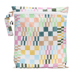 Roamio by Bumkins Wet Bag: Motley Check is a waterproof pouch with a colorful variegated checkered print, zipper closure, and side handle.