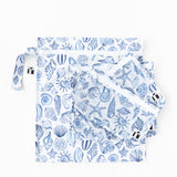 Roamio by Bumkins The Commuter Essential 4-Piece Set: Shells lays stacked on a white background.