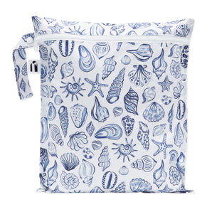 Roamio by Bumkins Wet Bag: Shells is a white waterproof pouch with a blue shell pattern, zipper closure, and side handle.