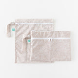 Two bags from Bumkins The Chaos Coordinator Deluxe 5-Piece Set: Wander lay overlapped on a white background.