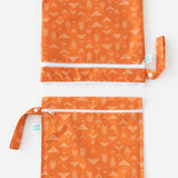 Bumkins Wet Bag + Wet/Dry Bag Set: Grounded is vertically arranged on a white background with only the top half of the bags visible.