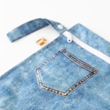Close-up of a bag from Roamio by Bumkins The Commuter Deluxe 5-Piece Set: Denim On Denim on a white background.