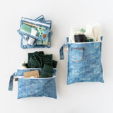 Roamio by Bumkins The Commuter Deluxe 5-Piece Set: Denim On Denim holds travel essentials on a white background.