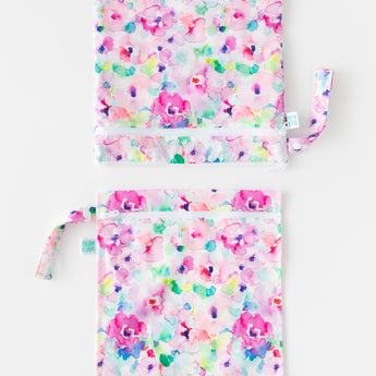 Bumkins Wet Bag + Wet/Dry Bag Set: Watercolor is vertically arranged on a white background with only the top half of the bags visible.