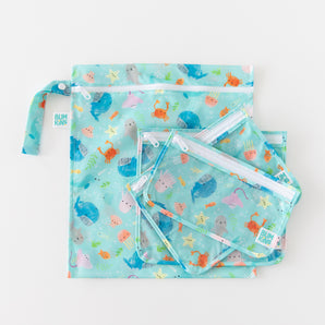 The Bumkins Wet Bag + Clear Travel Bag 3 Pack Set: Ocean Life features sea animal prints, ideal for travel organization.