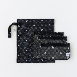 Bumkins The Chaos Coordinator Essential 4-Piece Set: Mickey Mouse Icon Black + White lays overlapped on a white background.