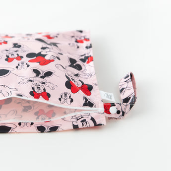 Bumkins Wet Bag: Minnie Mouse Classic sits opened on a white backdrop