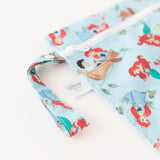 Close-up of Bumkins Wet Bag: Disney Princess Ariel on a white background, with focus on the strap and zipper.