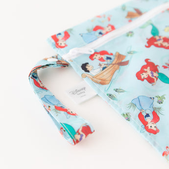 Close-up of Bumkins Wet Bag: Disney Princess Ariel on a white background, with focus on the strap and zipper.