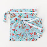 Bumkins Wet Bag: Disney Princess Ariel lays underneath other matching bags on a white background.
