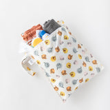 A bag from Bumkins On-The-Go Mealtime 7-Piece Set: Pooh Bear + Friends holds pool essentials on a white background.