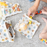 A mom and child play with toys in bags from Bumkins The Chaos Coordinator Essential 4-Piece Set: Disney Winnie + Friends on a gray rug.
