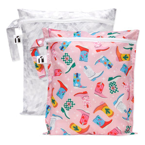Roamio by Bumkins Wet Bag 2 Pack: Disco Boots—one pink with cowboy boots, one gray with a geometric design.