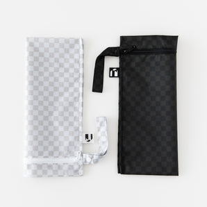 Roamio by Bumkins Wet Bag 2 Pack: Rich & Boujee—two zippered wet bags with handles, ideal for cloth diapers.