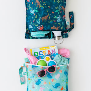 Bumkins Wet Bag 2 Pack: Ocean Life & Jungle—colorful, reusable bags for kids’ swim gear, toys, books, and sunglasses.