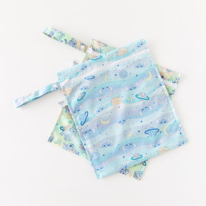 Bumkins Wet Bag 2 Pack: Disney Stitch Star-ring Up Trouble features colorful, reusable bags with cartoon Stitch, moons, and planets.