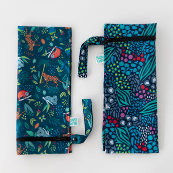 Bumkins Wet Bag 2 Pack: Jungle + Animal Prints lays on a white background with both bags side by side, folded lengthwise.