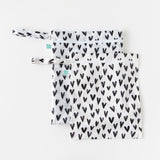 Bumkins Wet Bag + Wet/Dry Bag Set: Hearts lays overlapped on a white background.