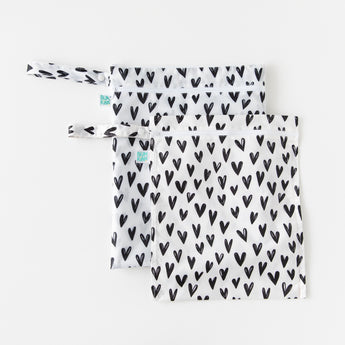 Bumkins Wet Bag + Wet/Dry Bag Set: Hearts lays overlapped on a white background.