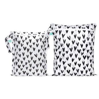 Bumkins Wet Bag + Wet/Dry Bag Set: Hearts features 2 white waterproof bags with black hearts and zipper closure.
