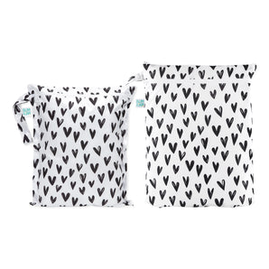 Bumkins Wet Bag + Wet/Dry Bag Set: Hearts—eco-friendly white bags with black hearts, zipper closures for wet/dry essentials.